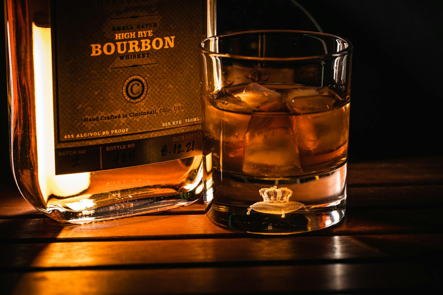 close up shot of a bourbon in a glass with ice